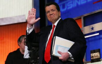 Neil Cavuto, moderator of the Fox Business Network Republican presidential debate arrives on stage at the North Charleston Coliseum and Performing Arts Center on January 14, 2016 in North Charleston, South Carolina.