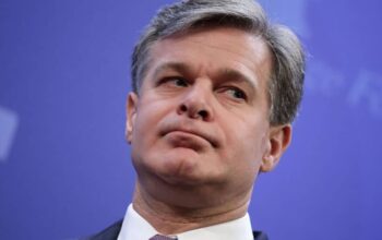 Federal Bureau of Investigation Director Christopher Wray prepares to deliver remarks arguing for the renewal of Section 702 of the Foreign Intelligence Surveillance Act at the Heritage Foundation October 13, 2017 in Washington, DC.