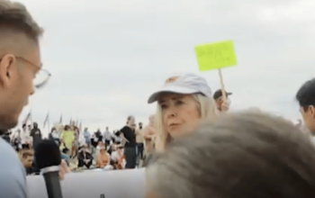 woman getting interviewed at gun protest