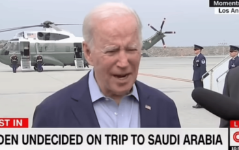 Biden speaking on tv in front of helicopter